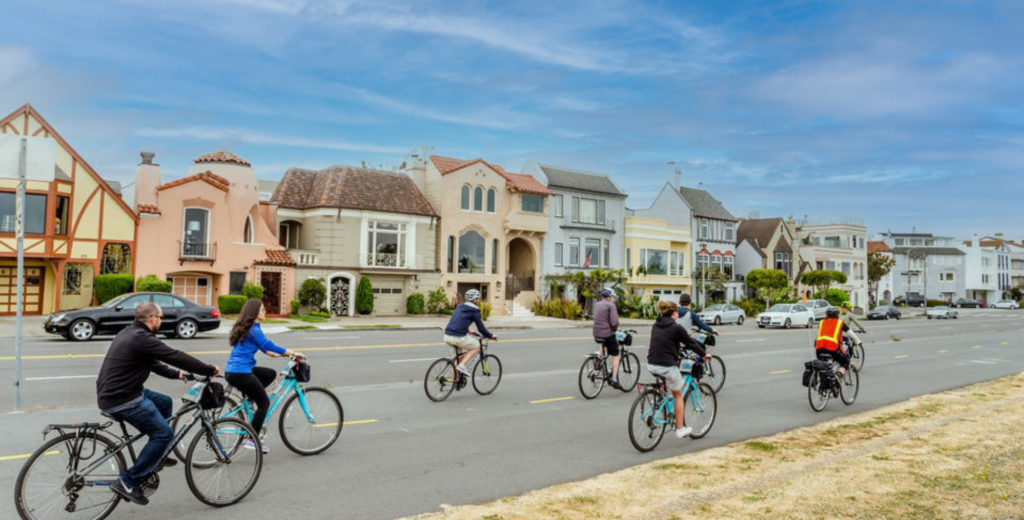 A group of people bike in San Francisco on a guided bike tour