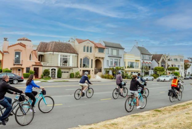 A group of people bike in San Francisco on a guided bike tour