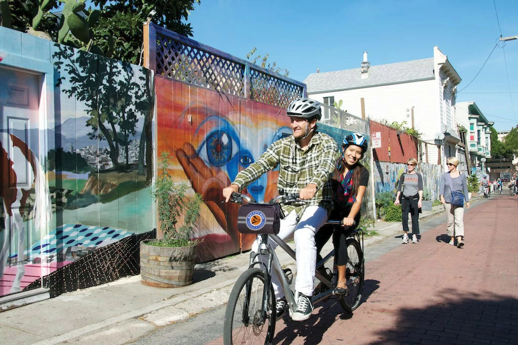 streets-of-san-francisco-bike-tour two people on a tandem bike on a guided bike tour